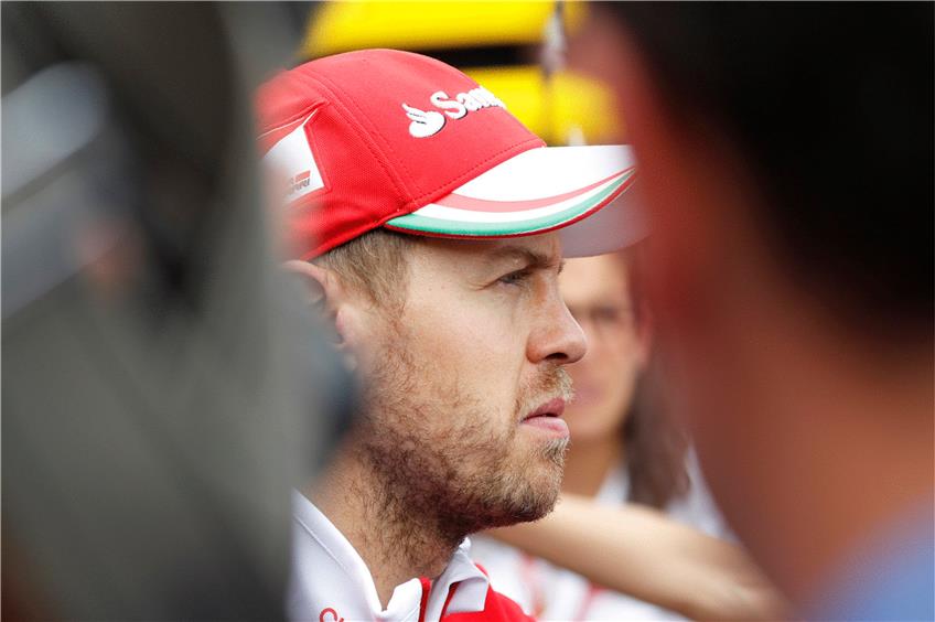 Die lausbübische Leichtigkeit ist verflogen: Sebastian Vettel fährt mit Ferrari hinterher. Foto: dpa